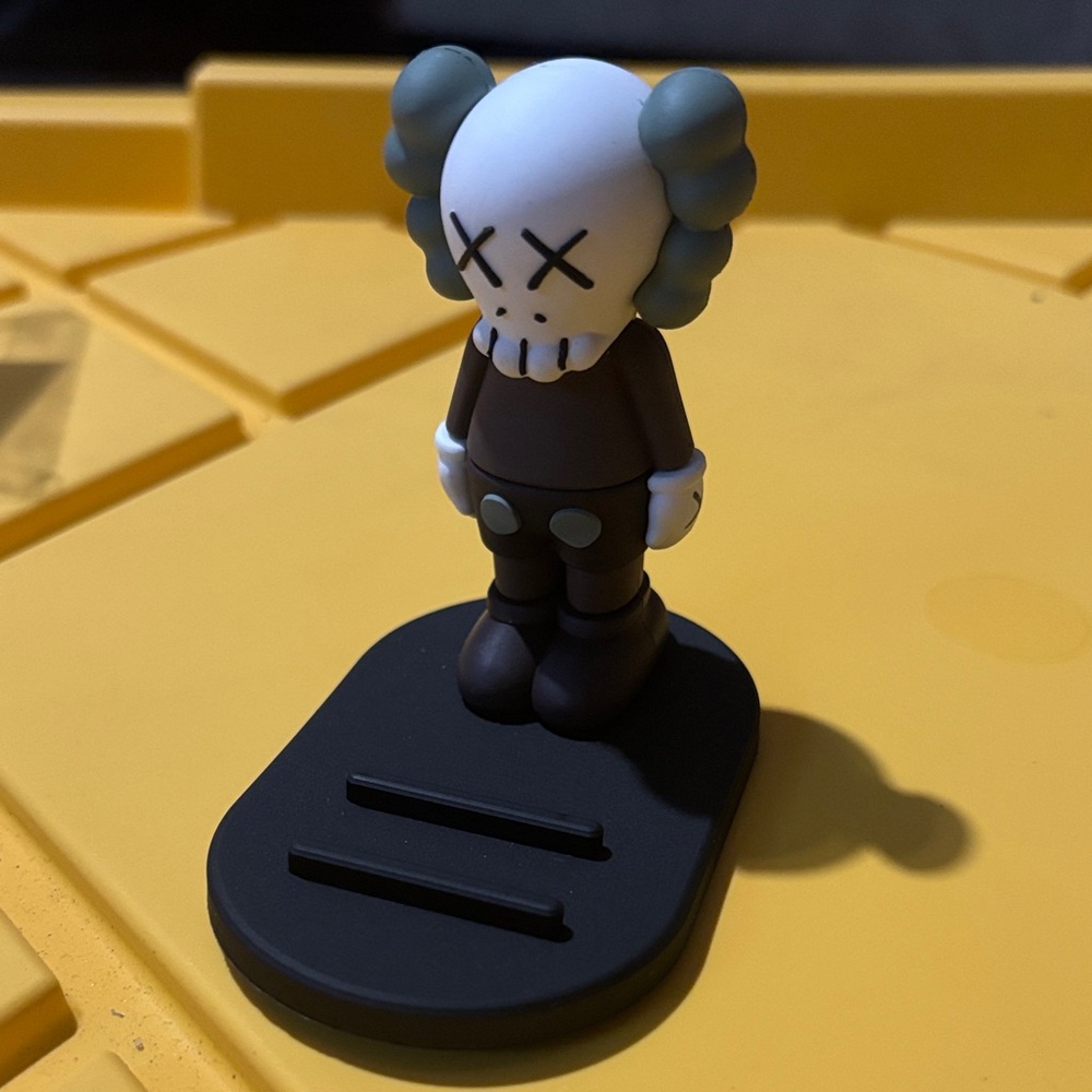 KAWS Gray and White Companion Figure phone holder